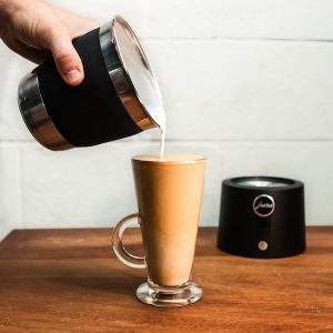 JURA Autofrother velvetiser pouring latte style textured milk